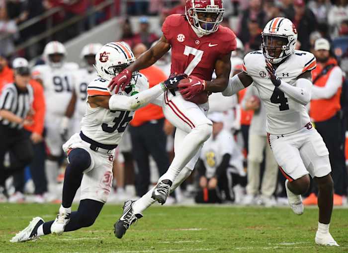 Auburn cornerback Jaylin Simpson (36) and cornerback D.J. James (4) combine to bring down Alabama wide receiver Ja'Corey Brooks (7) at Bryant-Denny Stadium.